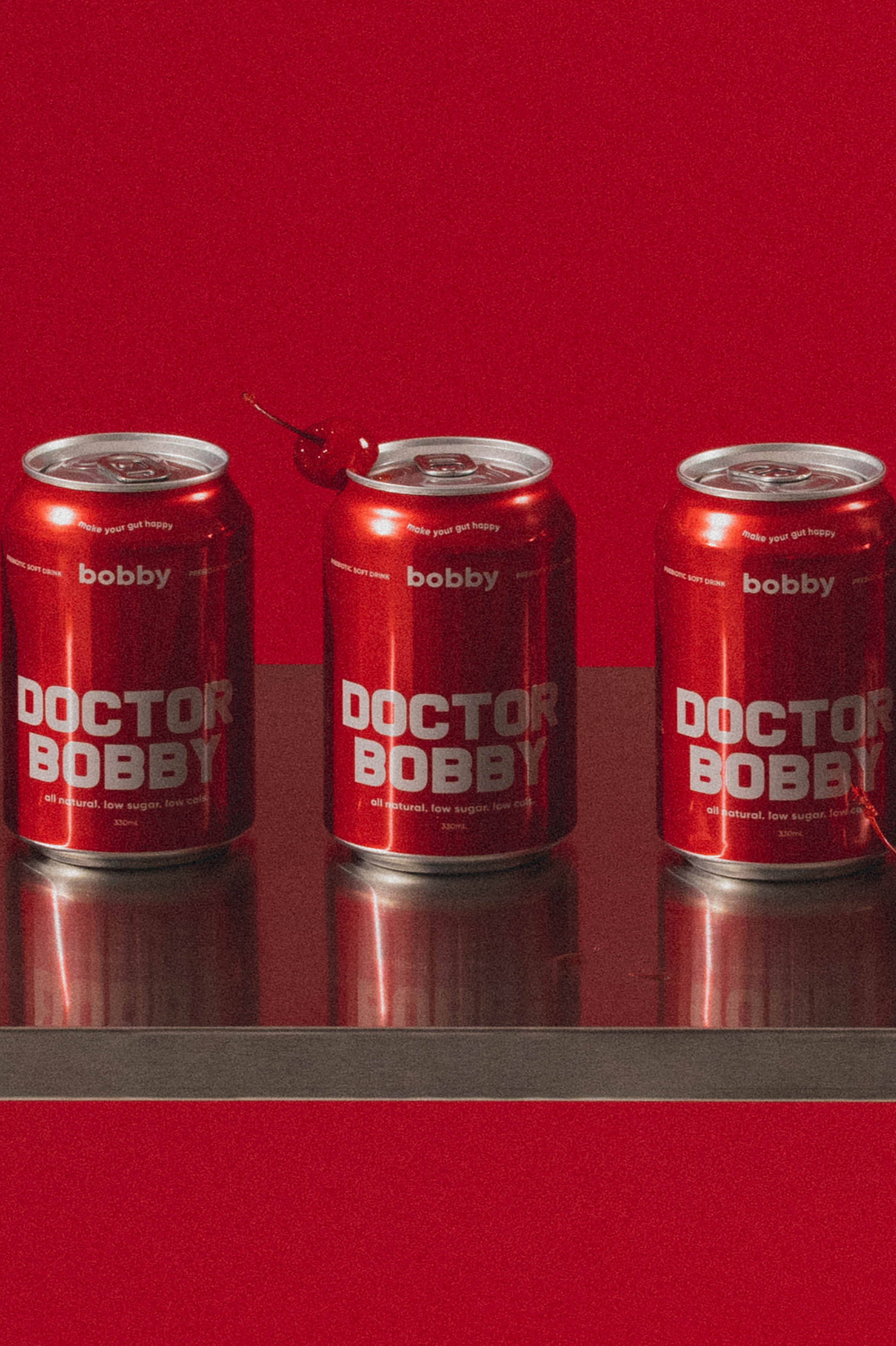 Australian-made cherry cola soft drink, a better-for-you alternative to doctor pepper that is low in calories and sugar filled with prebiotics to aid in gut digestion.