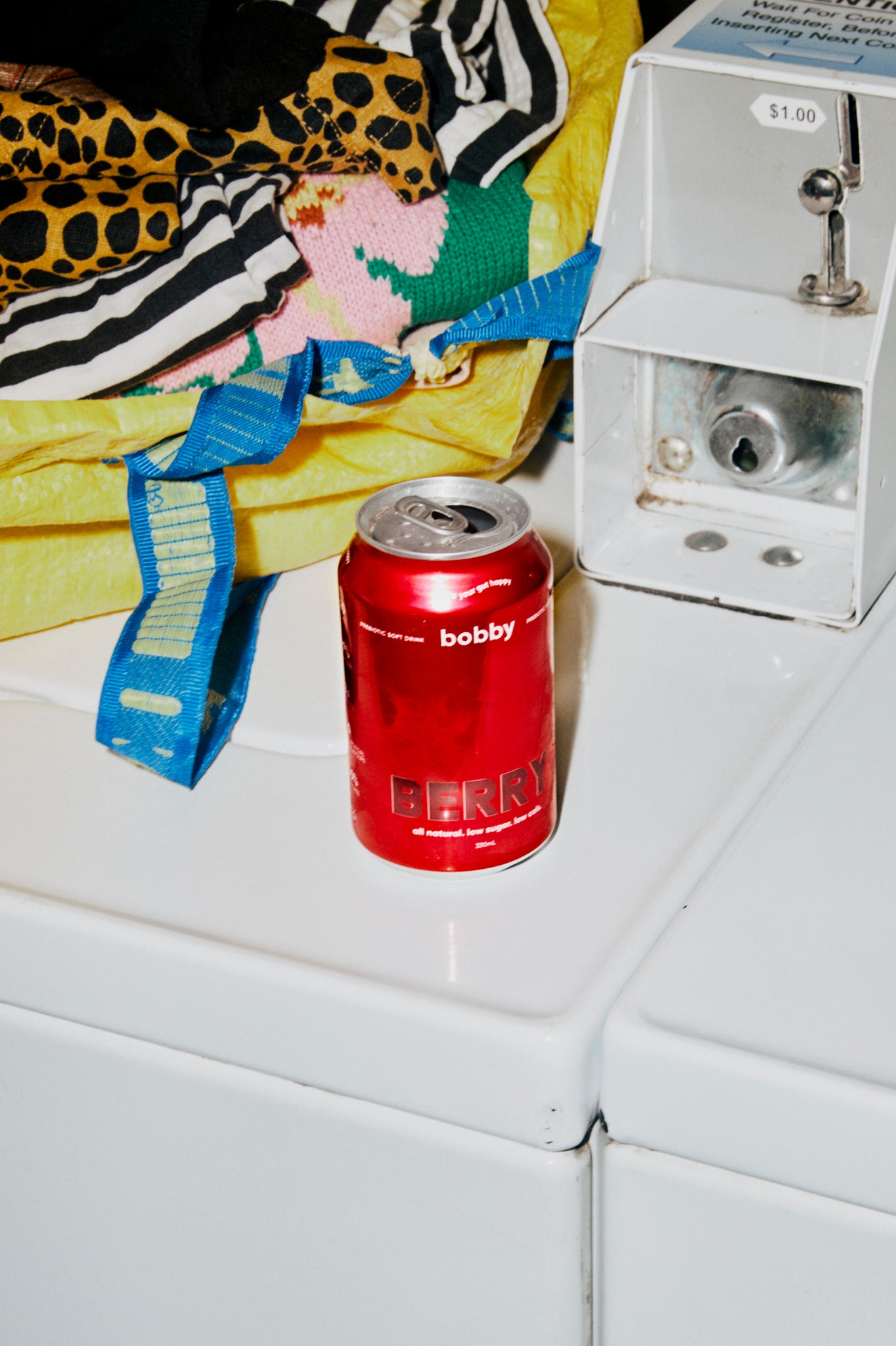  our radiant bobby berry soda photographed in an unconventional laundry mat