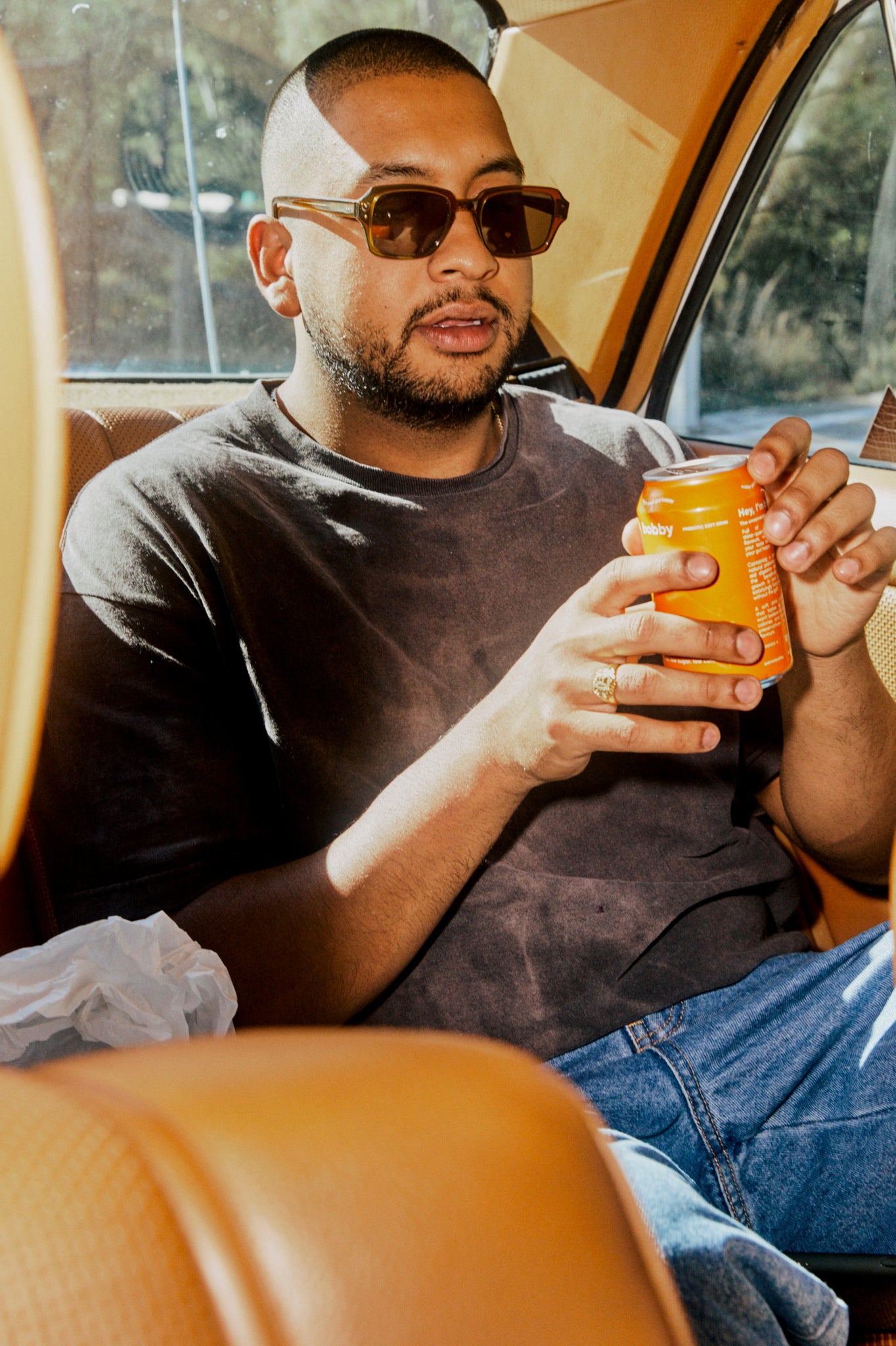Summer beach drives with a refreshing orange fanta soda to cool down in the Australian summer